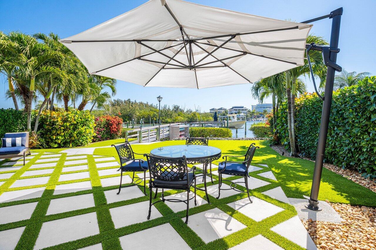 281 Fishermans Way Jupiter, FL 33477 - Photo 28 of 45 a view of a swimming pool with a patio