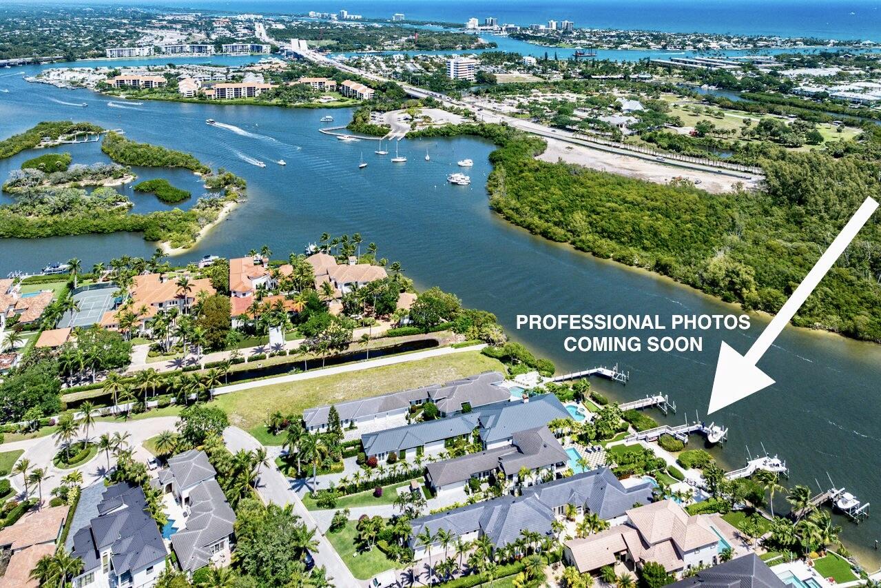 281 Fishermans Way Jupiter, FL 33477 - Photo 3 of 45 an aerial view of water body with boats and residential houses with outdoor space