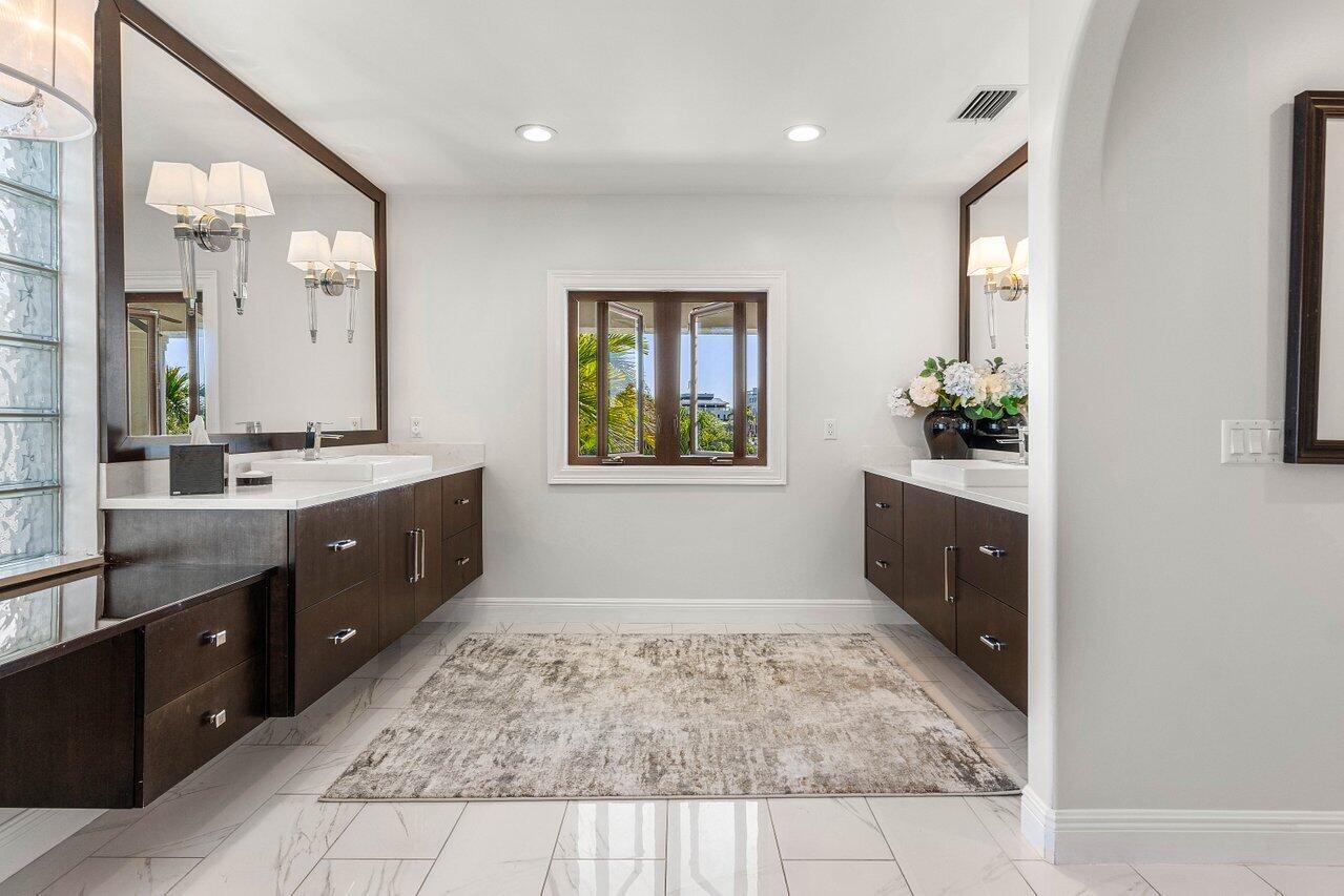 281 Fishermans Way Jupiter, FL 33477 - Photo 34 of 45 a spacious bathroom with a tub sink and mirror