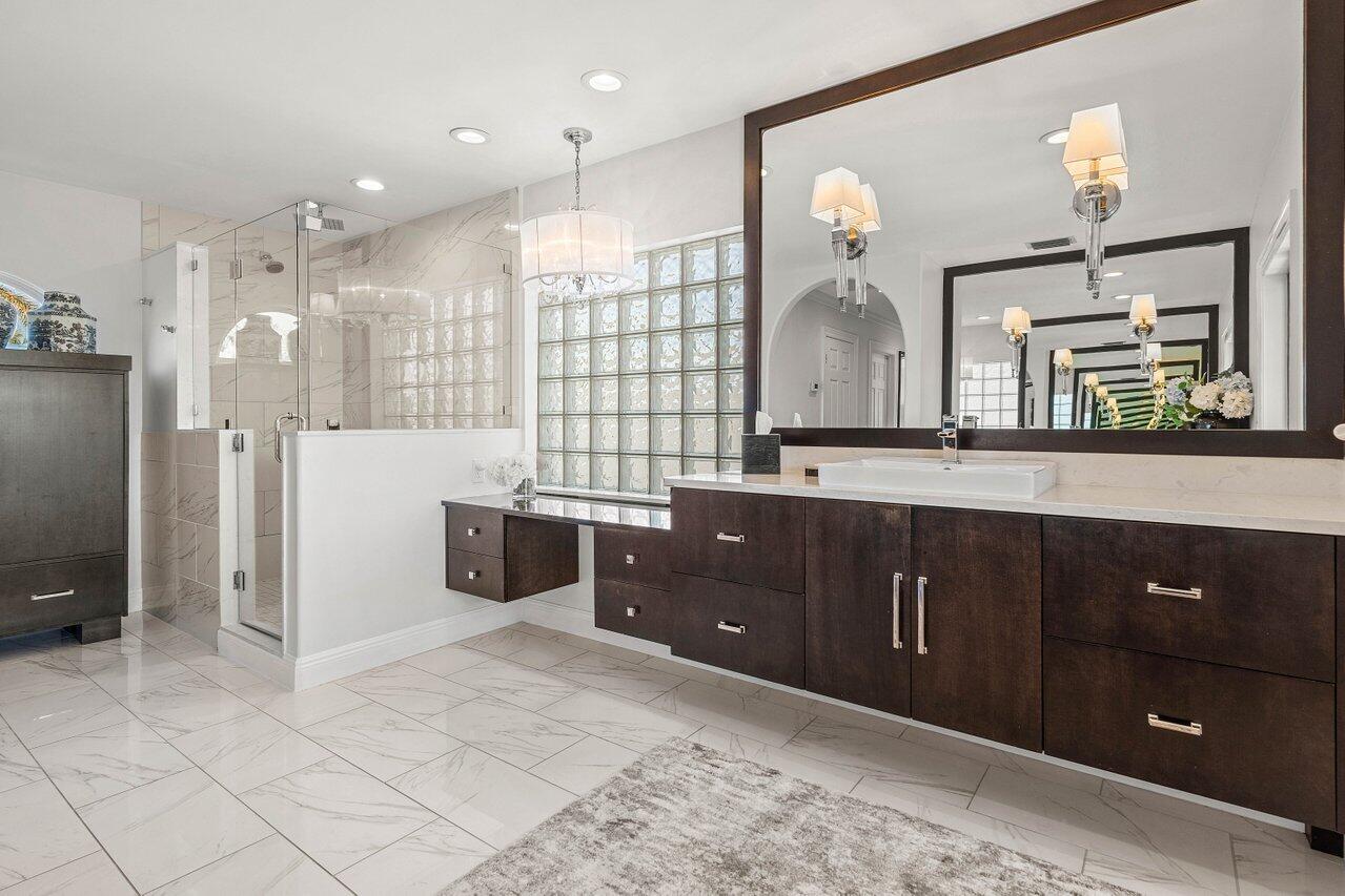 281 Fishermans Way Jupiter, FL 33477 - Photo 35 of 45 a spacious bathroom with a double vanity sink a mirror and shower