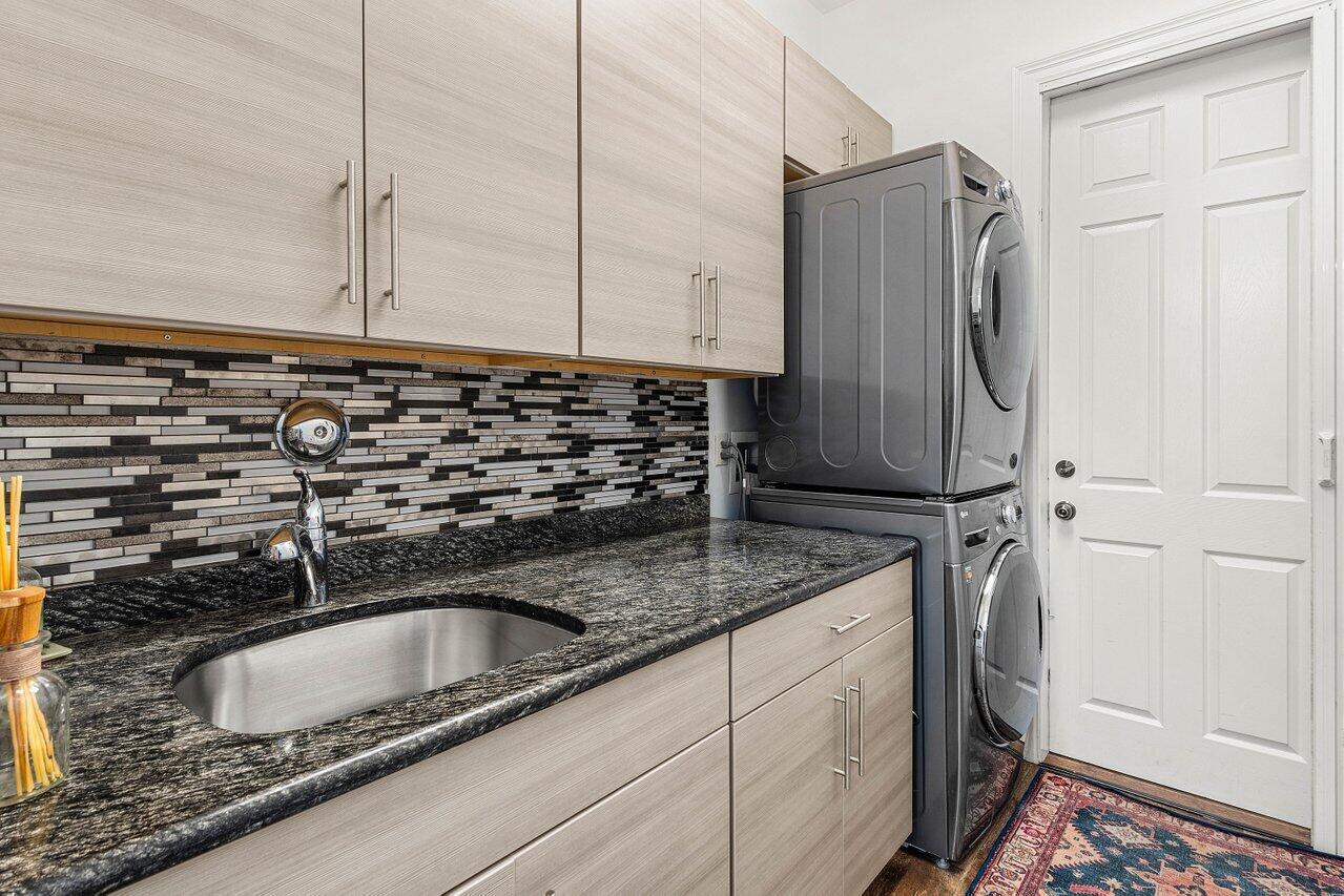 281 Fishermans Way Jupiter, FL 33477 - Photo 40 of 45 a kitchen with sink and cabinets