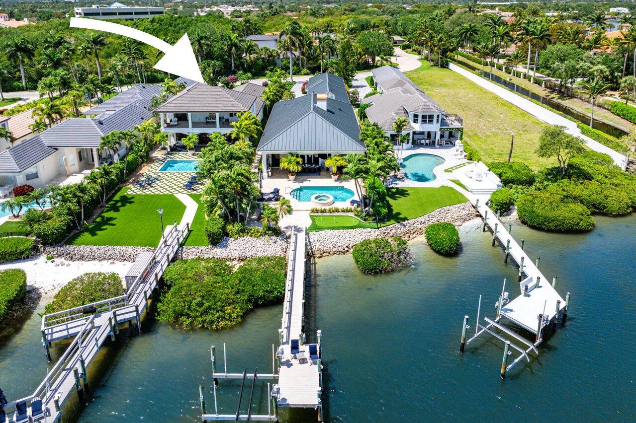 281 Fishermans Way Jupiter, FL 33477 - Photo 4 of 45 an aerial view of a house with swimming pool patio and outdoor seating