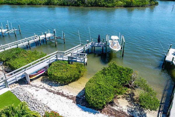 an aerial view of a house with a lake view