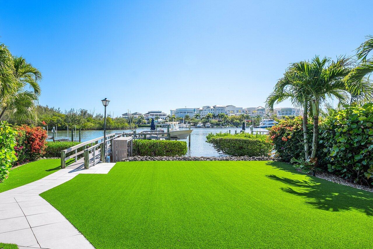 281 Fishermans Way Jupiter, FL 33477 - Photo 6 of 45 a view of a garden and swimming pool