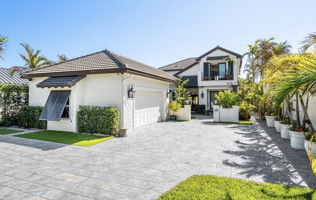 281 Fishermans Way Jupiter, FL 33477 - Photo 9 of 45 a view of a house with a yard and plants