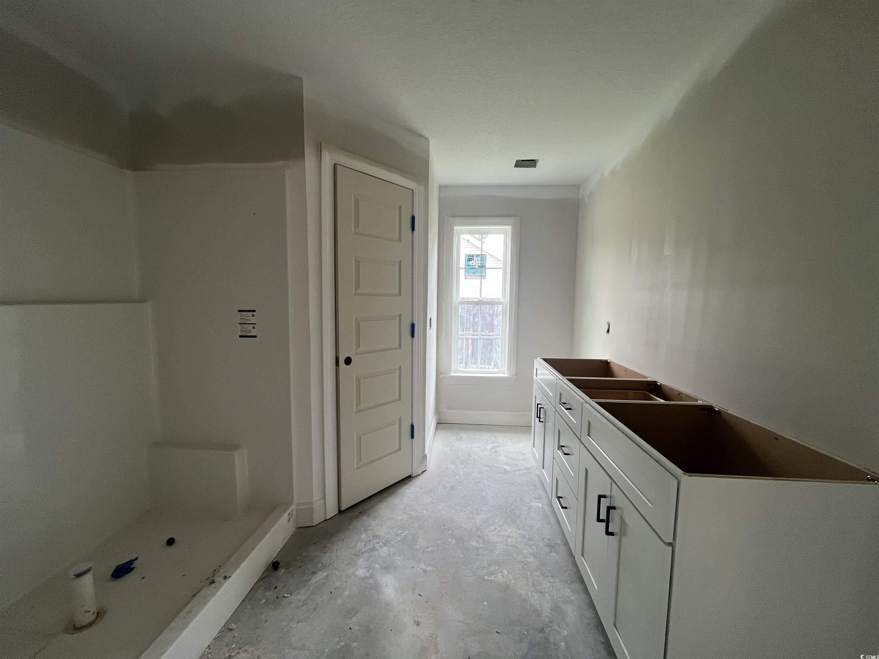 475 Highway 348 Loris, SC 29569 - Photo 8 of 11 Bathroom with a shower stall, unfinished concrete flooring, and vanity