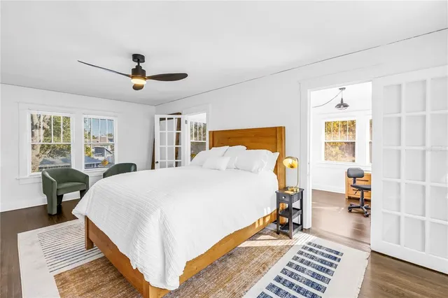 a bed room with a bed and a chandelier