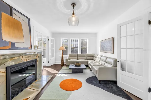 a living room with furniture a fireplace and a table