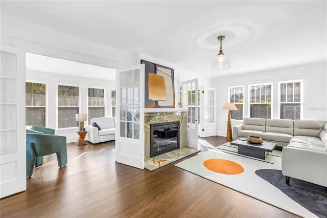 a living room with furniture and a fireplace