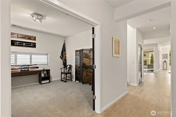 a view of a livingroom with furniture and windows