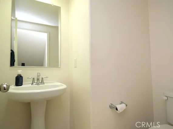a bathroom with a sink and mirror