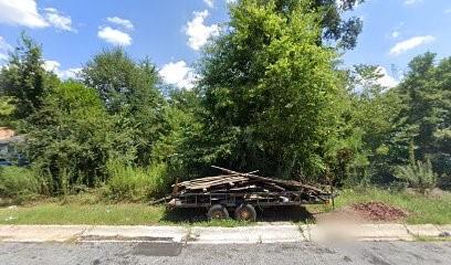 a side view of a car parked on the side of the road