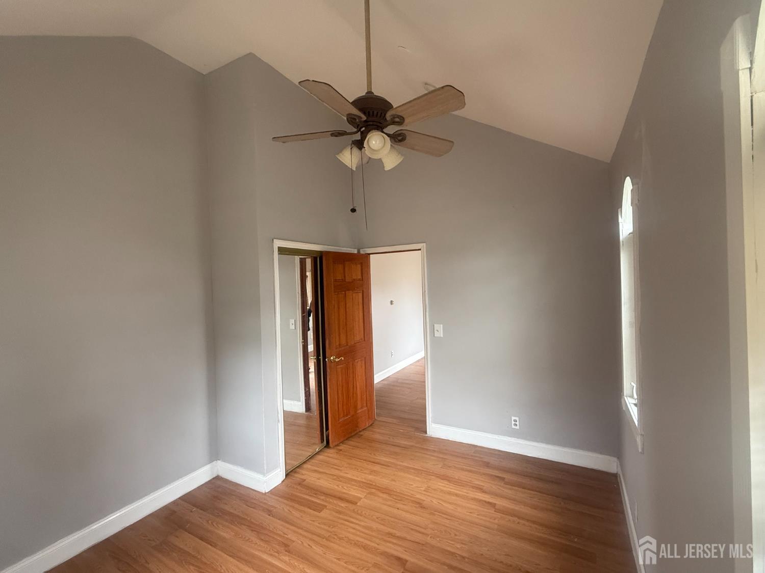 64 Fiat Avenue Iselin, NJ 08830 - Photo 11 of 25 a view of a livingroom with a ceiling fan and wooden floor