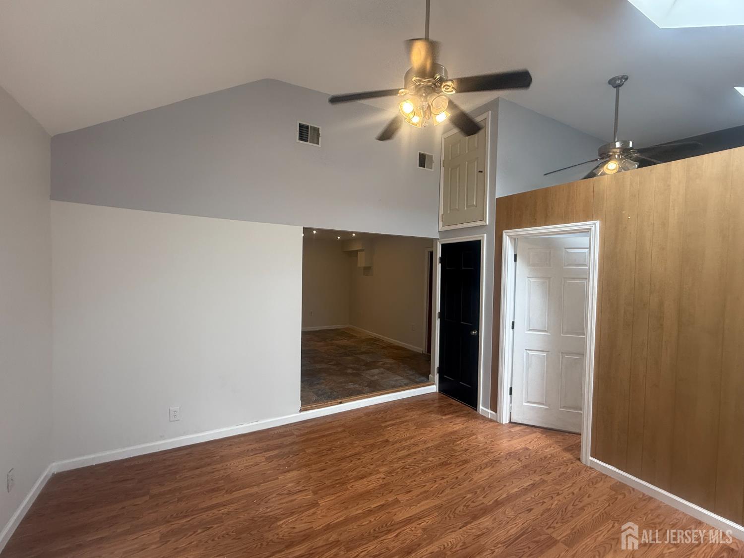 64 Fiat Avenue Iselin, NJ 08830 - Photo 22 of 25 a view of an empty room with wooden floor