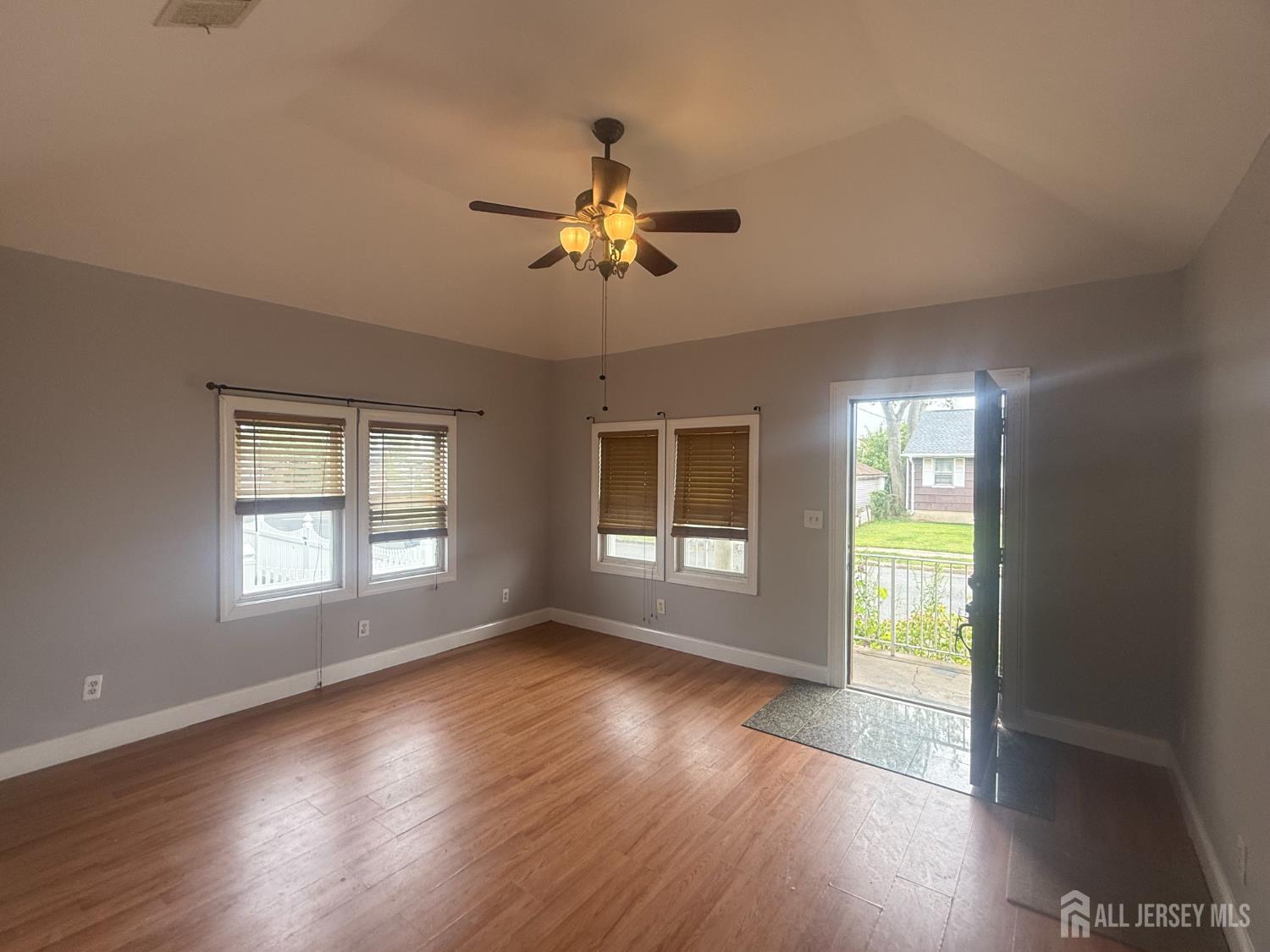 64 Fiat Avenue Iselin, NJ 08830 - Photo 9 of 25 a view of empty room with wooden floor and fan