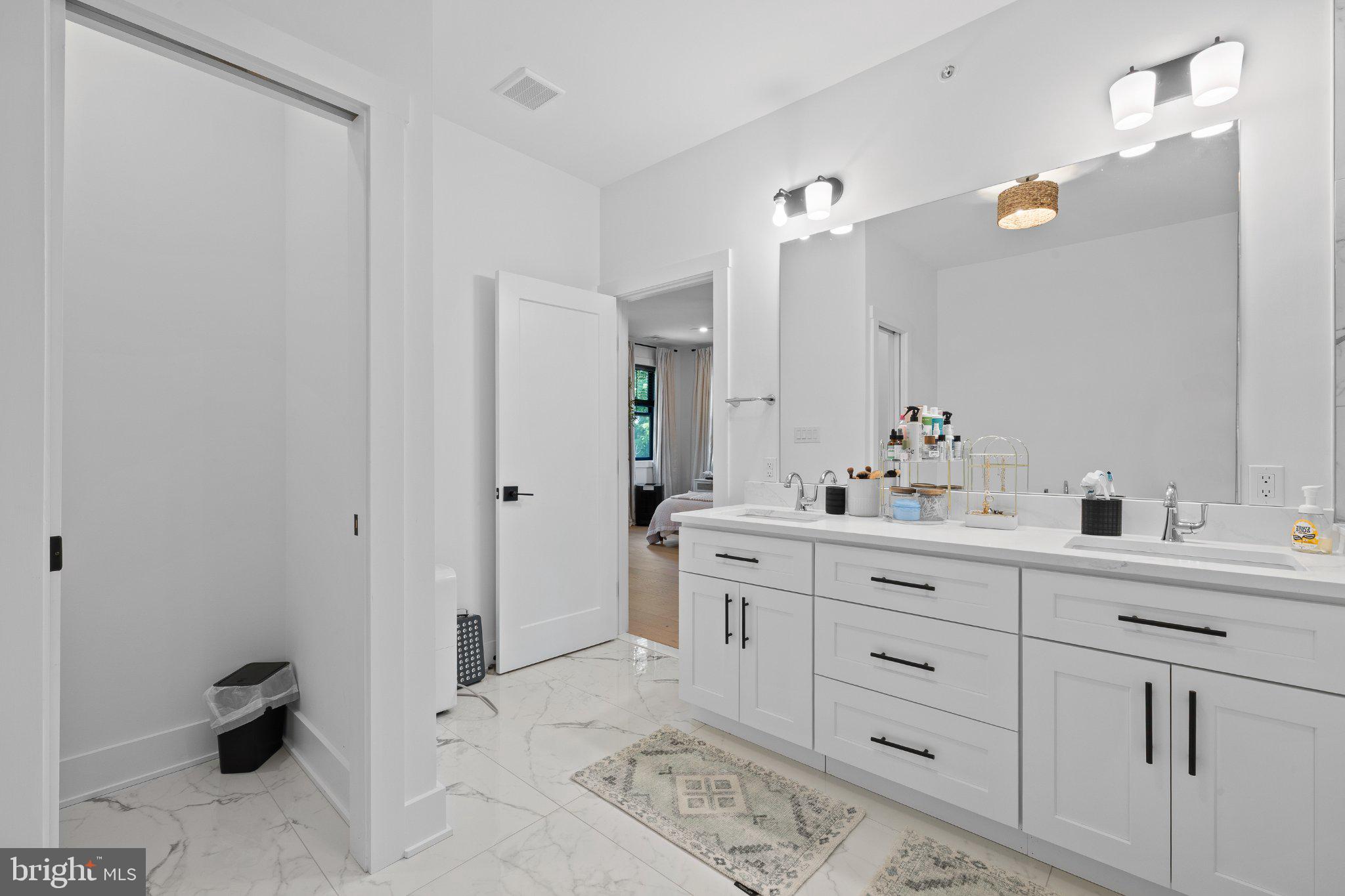 985 Henry Avenue Wayne, PA 19087 - Photo 22 of 28 Sleek modern bathroom with elegance.