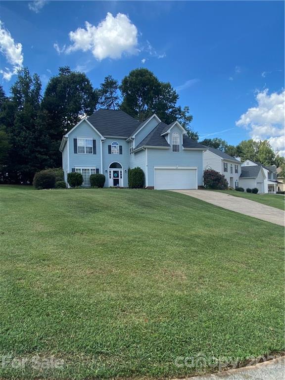 715 West Cheval Drive Fort Mill, SC 29708 - Photo 2 of 18 a view of a house with a big yard and large trees