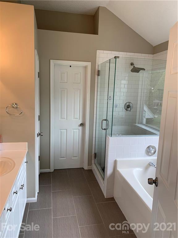 715 West Cheval Drive Fort Mill, SC 29708 - Photo 11 of 18 a bathroom with a tub shower sink and vanity