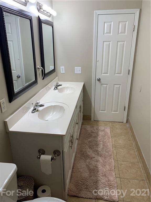 715 West Cheval Drive Fort Mill, SC 29708 - Photo 13 of 18 a bathroom with a sink a toilet and mirror