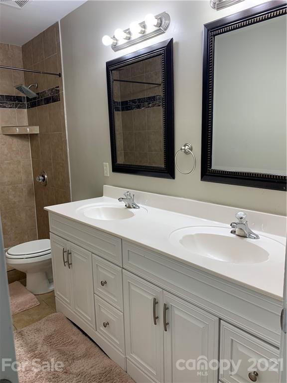 715 West Cheval Drive Fort Mill, SC 29708 - Photo 14 of 18 a bathroom with a double vanity sink and mirror