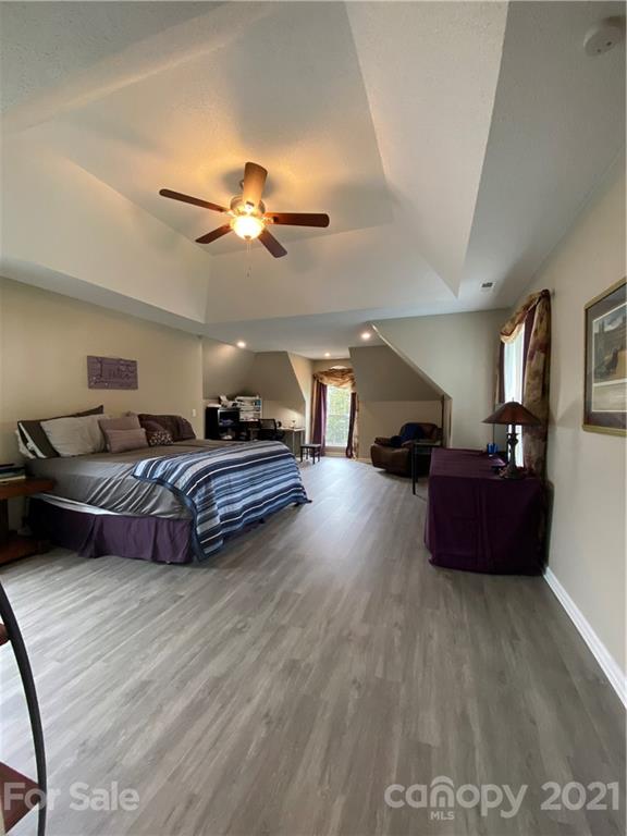 715 West Cheval Drive Fort Mill, SC 29708 - Photo 9 of 18 a living room with furniture a ceiling fan and a rug