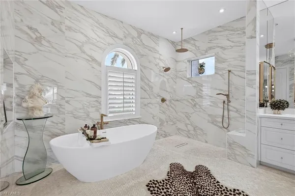 a bathroom with a bathtub sink and toilet