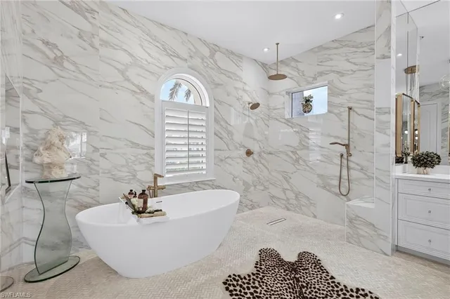 a bathroom with a bathtub sink and toilet