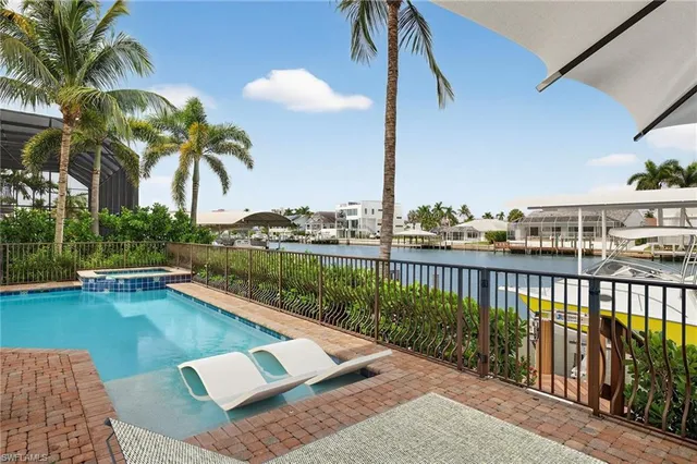 a view of balcony with furniture and garden