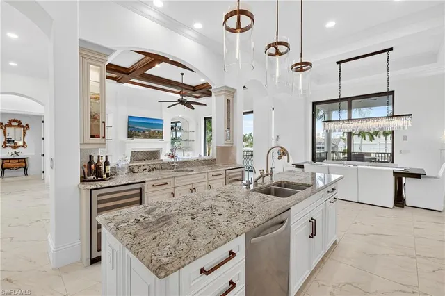 a kitchen with stainless steel appliances granite countertop a sink and stove