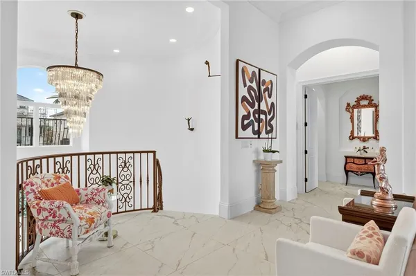 a view of a livingroom with furniture and windows