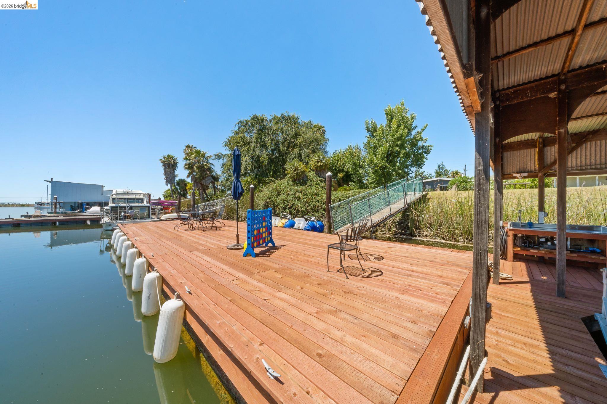 1704 Taylor Road Bethel Island, CA 94511 - Photo 57 of 73 Spacious waterside deck featuring wood planking