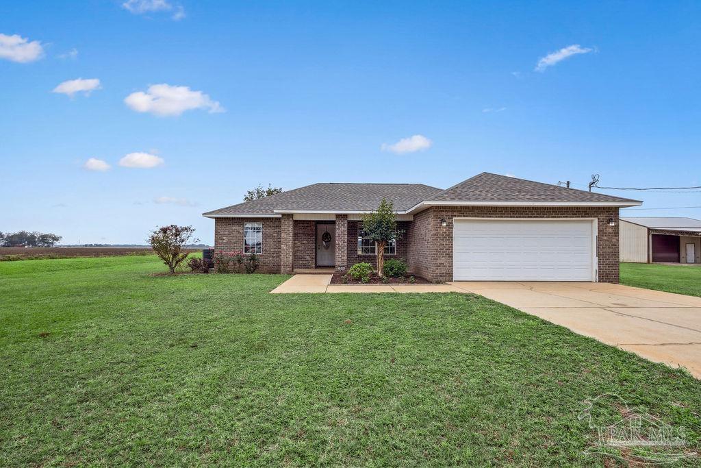 a front view of a house with a garden and porch