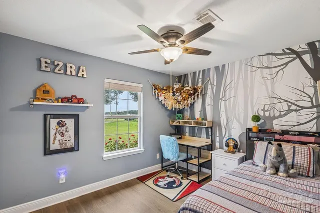 a bedroom with furniture and a window