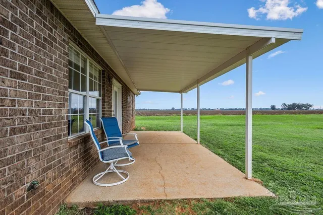 a view of a backyard with sitting area