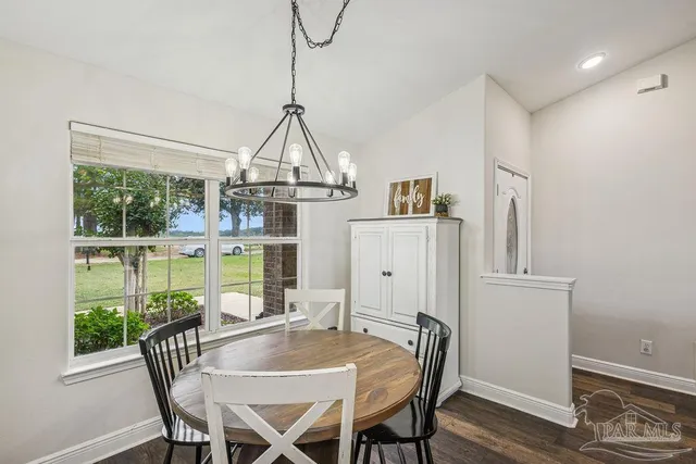 a view of a dining room with furniture window and outside view