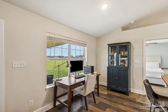 a view of a workspace with furniture