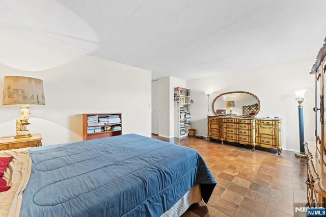 a bathroom with a granite countertop sink mirror and toilet