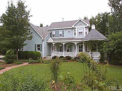 9504 Sauls Road Raleigh, NC 27603 - Photo 1 of 1 a front view of a house with a yard