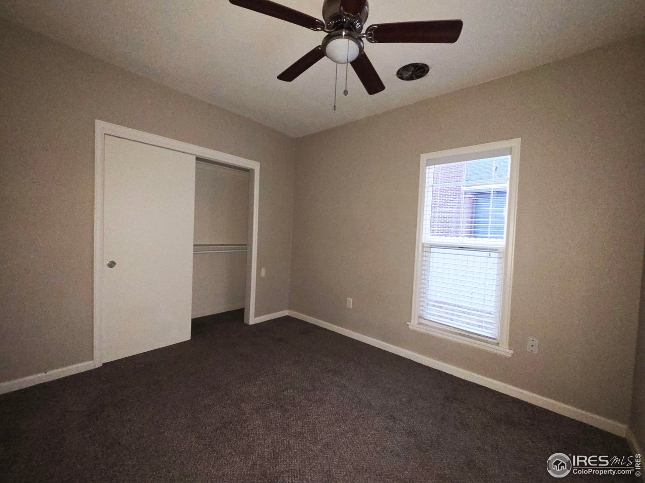 523 Chestnut Street Sterling, CO 80751 - Photo 8 of 13 a view of an empty room with a window