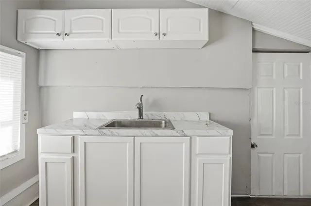 a utility room with a sink washer and dryer