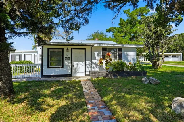 a view of a house with a garden