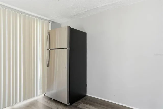 a view of a refrigerator in kitchen