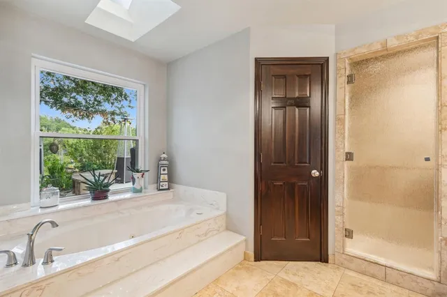 a bathroom with a tub and a sink