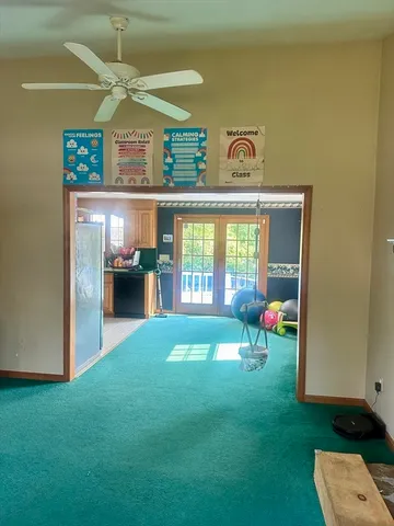 a living room with furniture and a yard