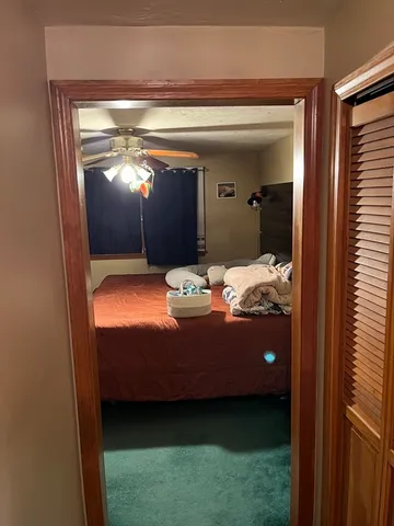 a bed room with a bed and a television