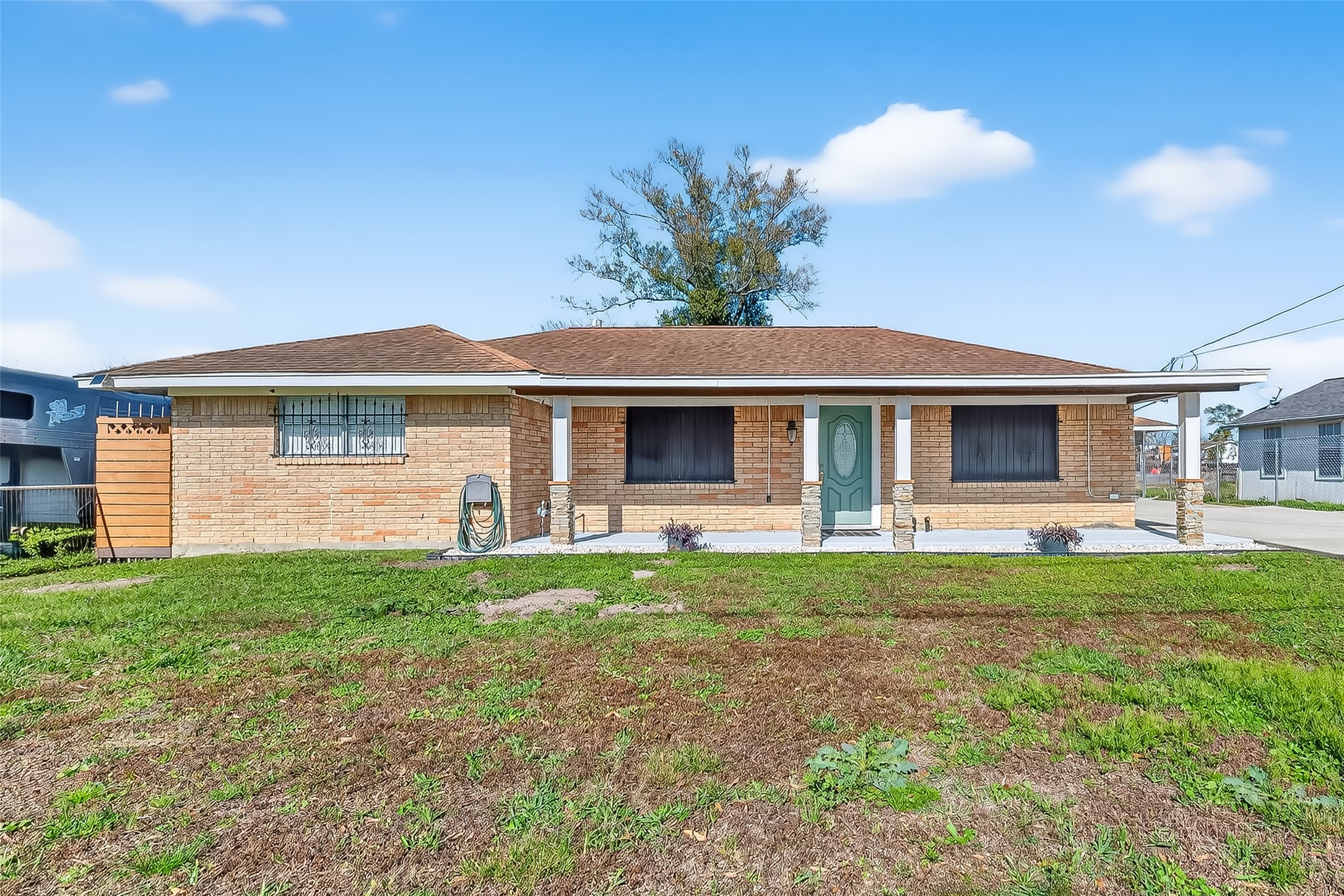 16415 1st Street Channelview, TX 77530 - Photo 1 of 28 a front view of a house with a garden