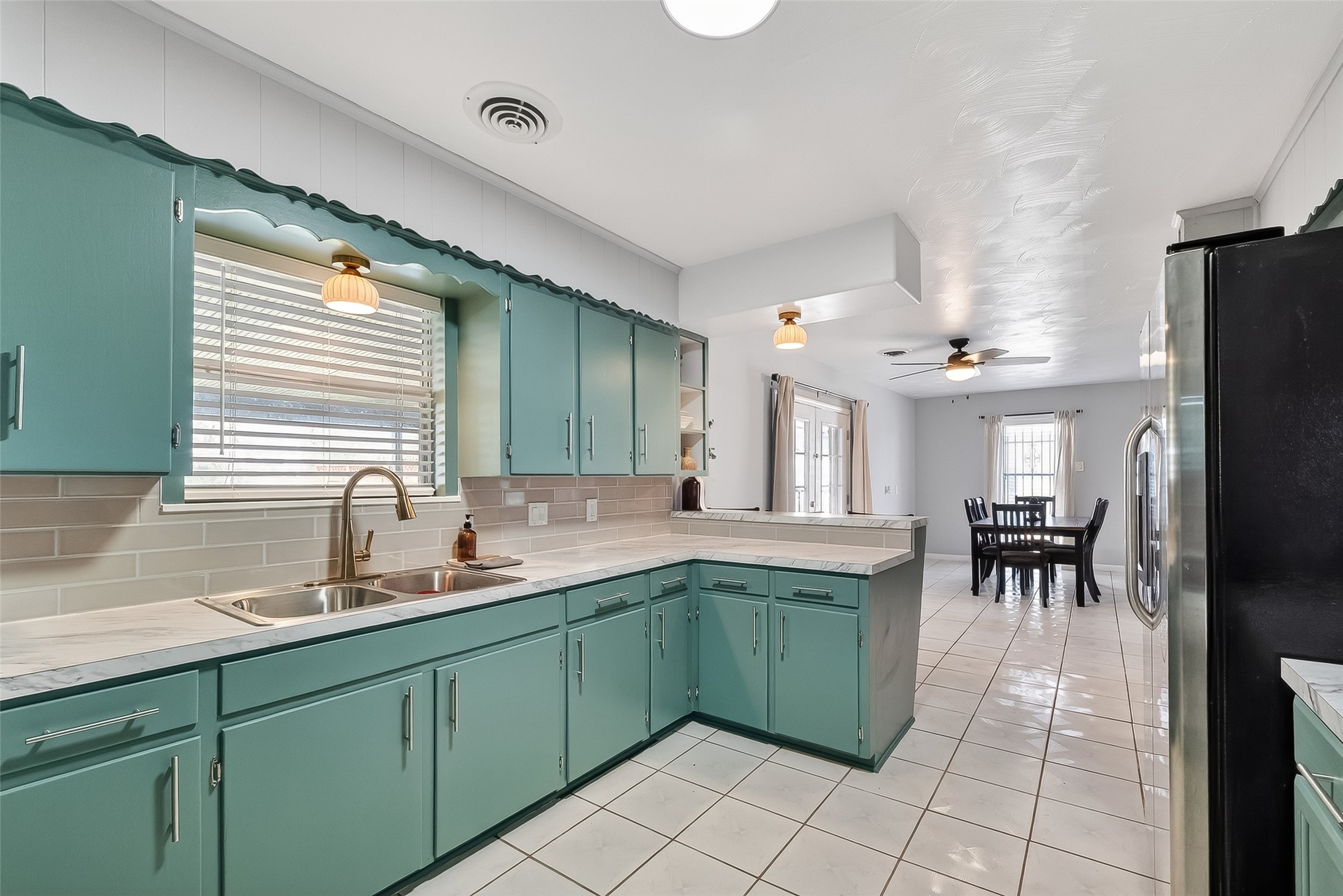 16415 1st Street Channelview, TX 77530 - Photo 11 of 28 a kitchen with a sink and cabinets