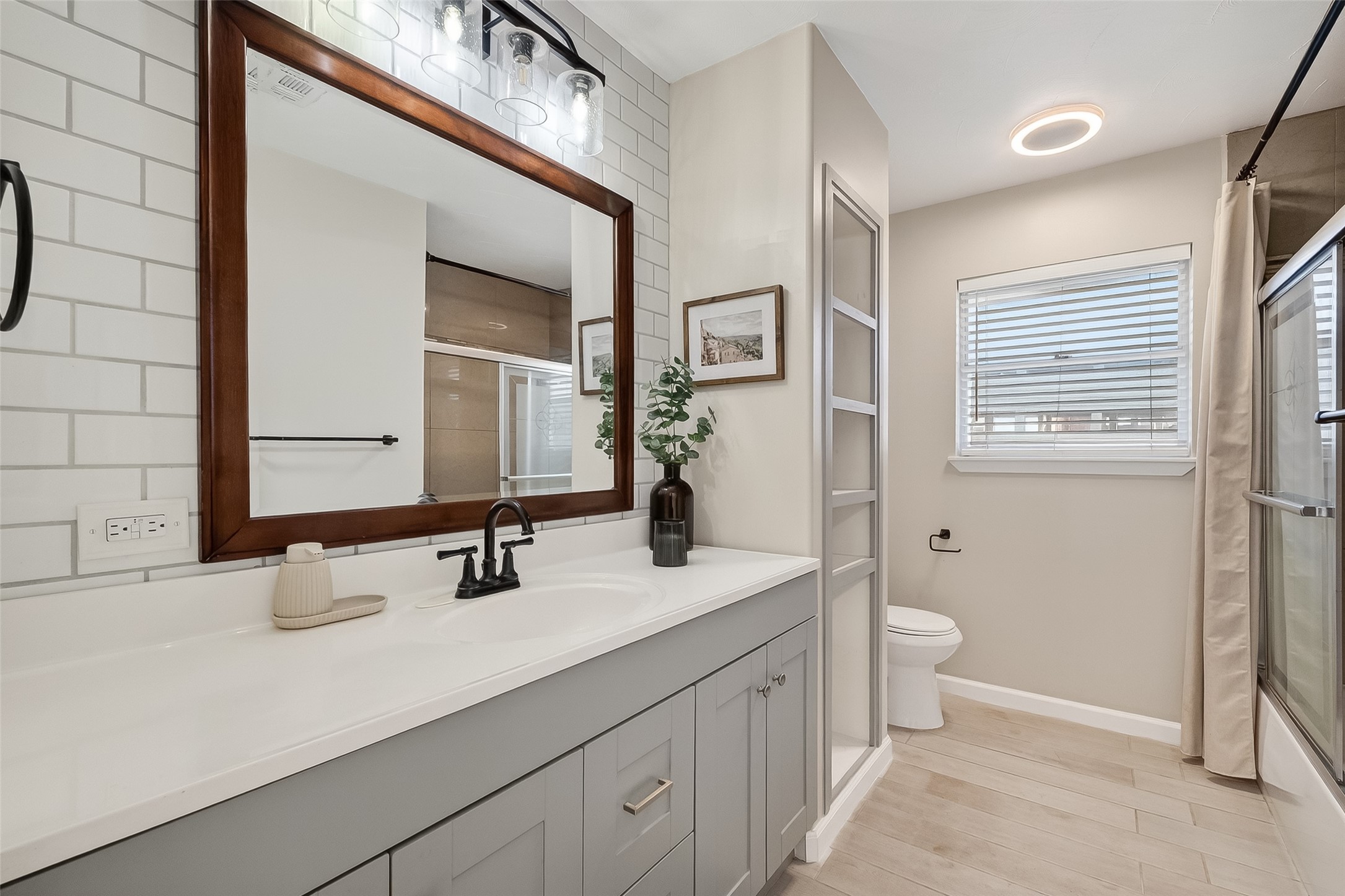 16415 1st Street Channelview, TX 77530 - Photo 14 of 28 a bathroom with a double vanity sink mirror and toilet