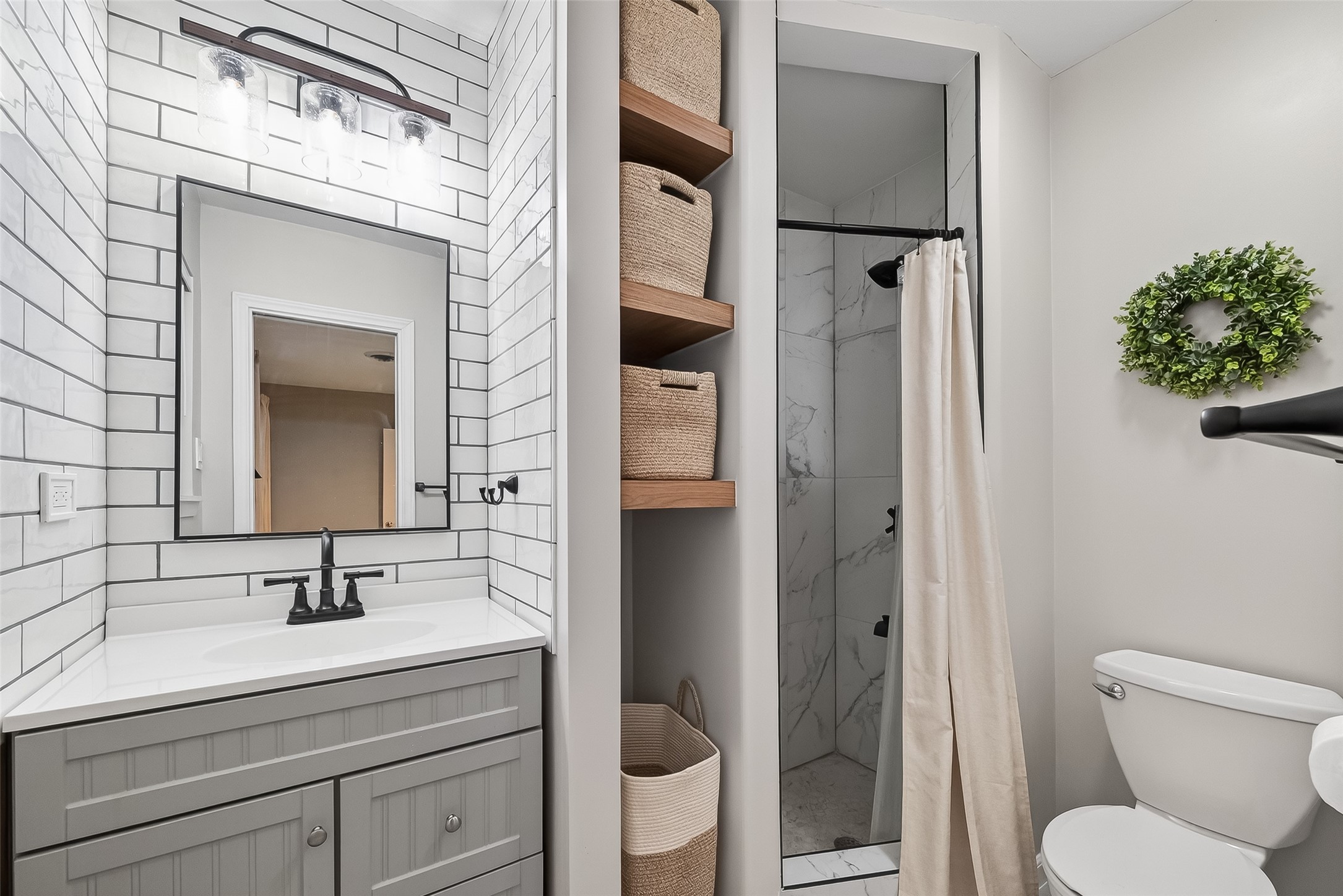 16415 1st Street Channelview, TX 77530 - Photo 19 of 28 a bathroom with a granite countertop sink toilet and shower