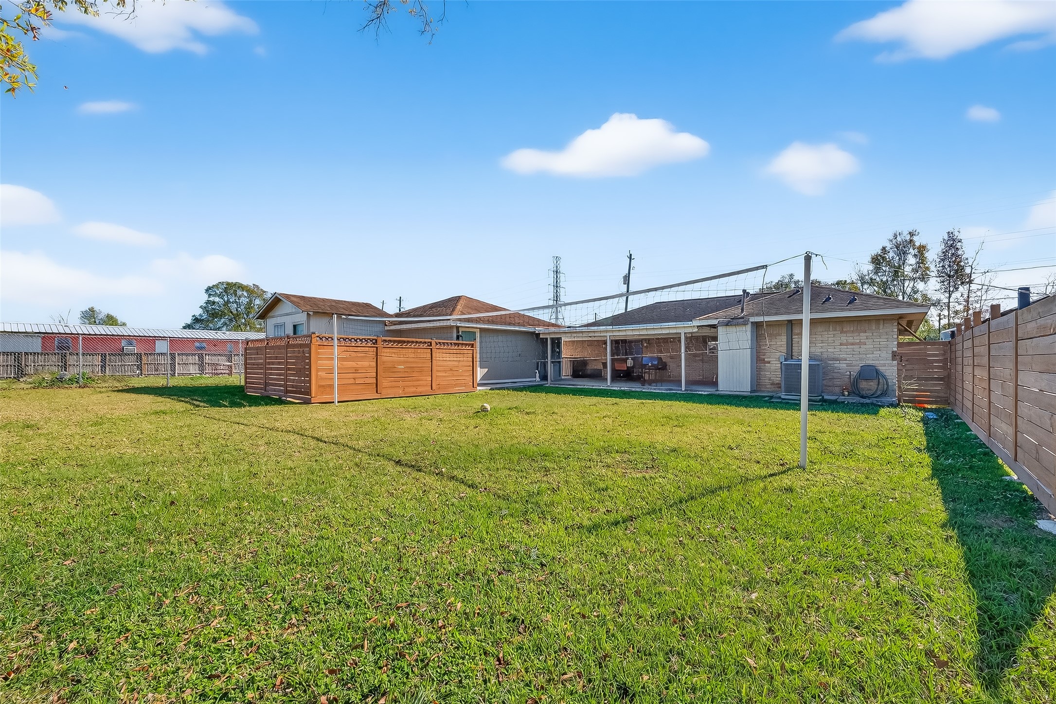 16415 1st Street Channelview, TX 77530 - Photo 25 of 28 a view of a house with a big yard and large trees